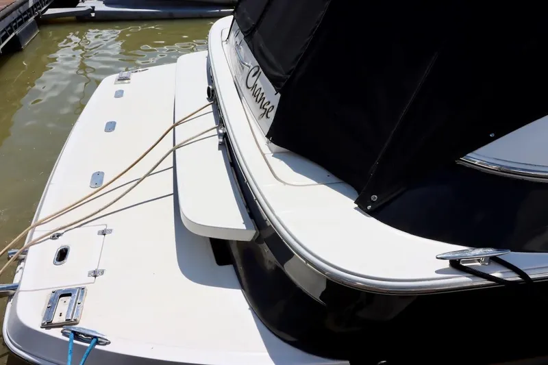 Cool Change Yacht Photos Pics 2006 Regal Commodore 4460 yacht docked, featuring a sleek white and black design.