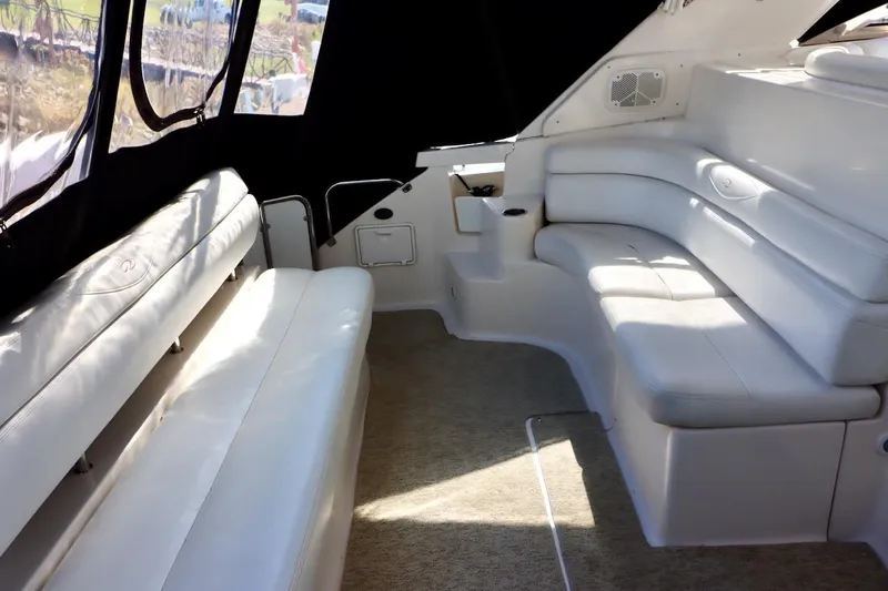 Cool Change Yacht Photos Pics Interior of 2006 Regal Commodore 4460 yacht with white leather seating.