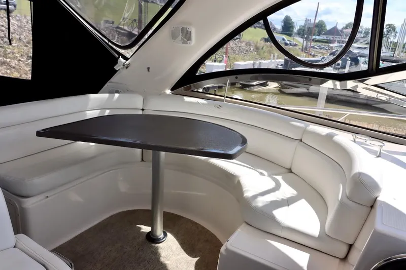 Cool Change Yacht Photos Pics Luxurious interior of 2006 Regal Commodore 4460 yacht with white seating and table.