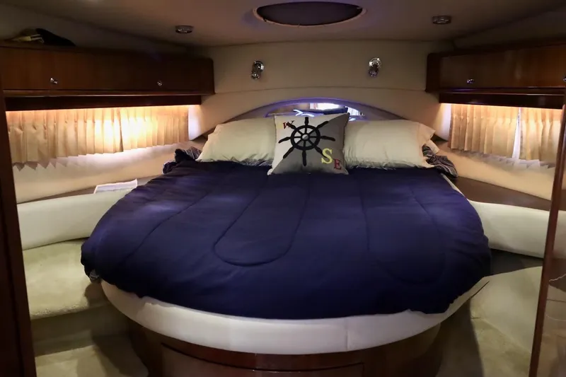 Cool Change Yacht Photos Pics Luxurious 2006 Regal Commodore 4460 yacht bedroom with cozy bedding and nautical decor.