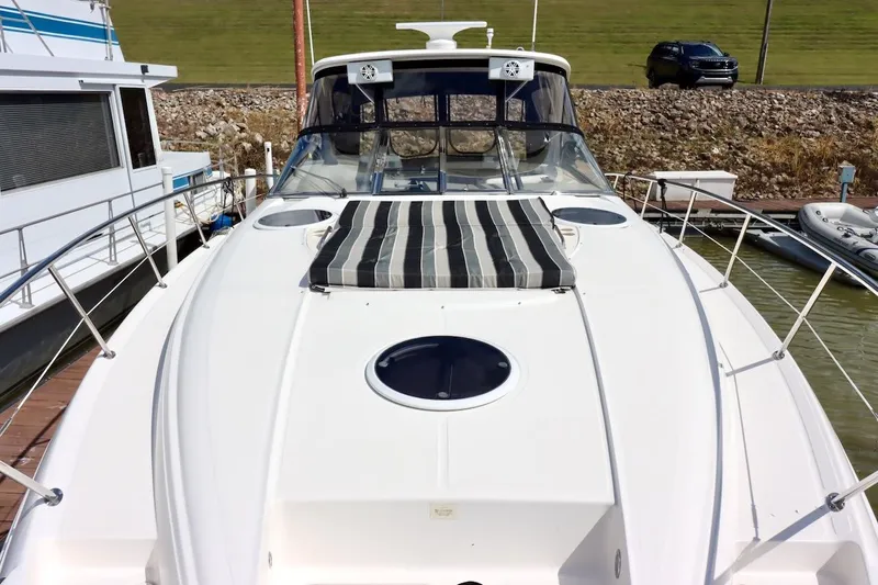 Cool Change Yacht Photos Pics 2006 Regal Commodore 4460 yacht docked, featuring sleek design and spacious deck.