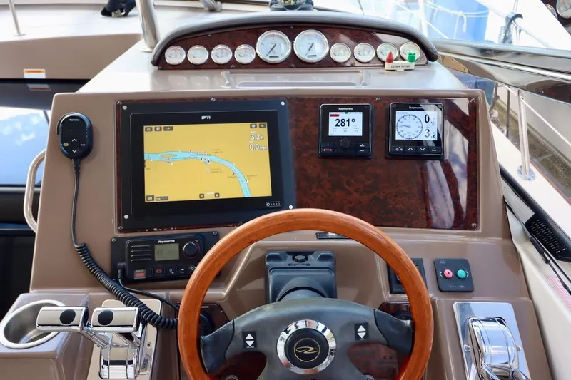 Cool Change Yacht Photos Pics 2006 Regal Commodore 4460 yacht dashboard with navigation and control instruments.