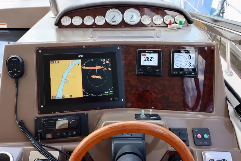 Cool Change Yacht Photos Pics 2006 Regal Commodore 4460 yacht dashboard with navigation and control instruments.
