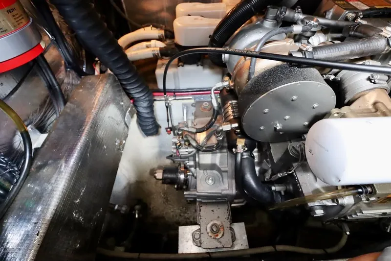 Cool Change Yacht Photos Pics Engine compartment of 2006 Regal Commodore 4460 boat, showcasing mechanical components and wiring.