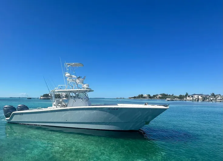 Miss Mae Yacht Photos Pics Freeman 2014 boat on clear blue water under a bright sky.