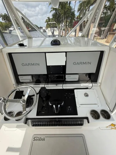 Miss Mae Yacht Photos Pics Freeman 2014 boat dashboard with dual Garmin displays and steering wheel.