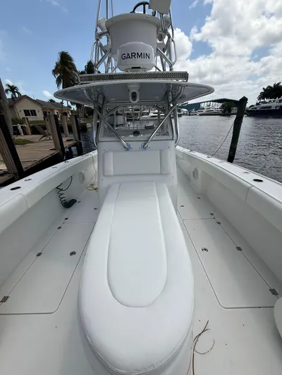 Miss Mae Yacht Photos Pics 2014 Freeman boat with Garmin equipment docked by waterfront homes.