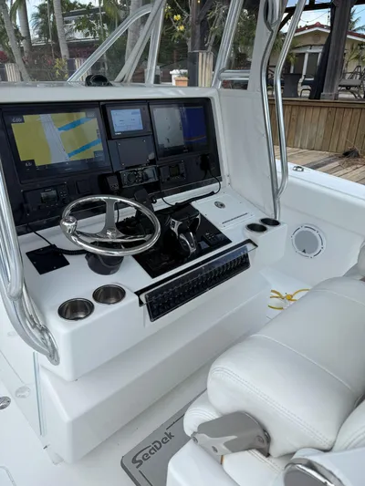 Miss Mae Yacht Photos Pics Freeman 2014 boat cockpit with advanced navigation system and steering wheel.