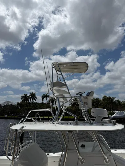 Miss Mae Yacht Photos Pics 2014 Freeman boat with elevated helm, set against a cloudy sky and waterfront view.