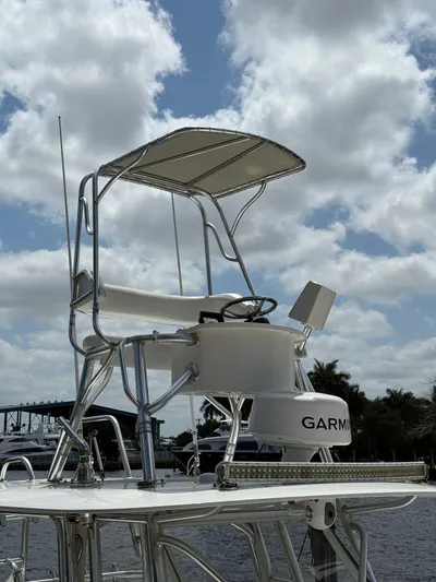 Miss Mae Yacht Photos Pics Freeman 2014 boat with elevated helm and Garmin equipment under a cloudy sky.