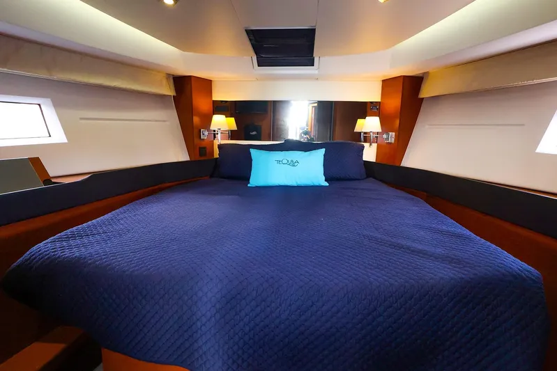 Tequila Little Time II Yacht Photos Pics Luxurious cabin interior of 2015 Jeanneau NC 14 yacht with cozy bedding.