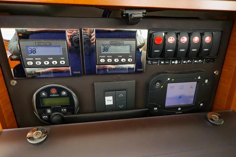Tequila Little Time II Yacht Photos Pics Control panel of 2015 Jeanneau NC 14 boat with digital displays and switches.