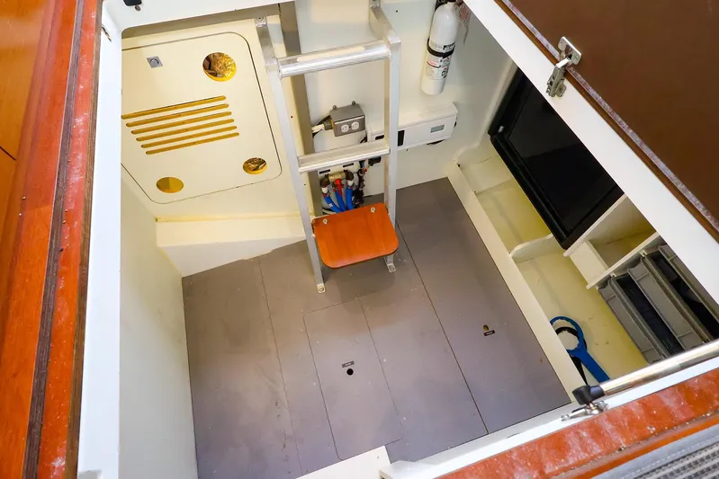 Tequila Little Time II Yacht Photos Pics Engine room of 2015 Jeanneau NC 14 boat with ladder and equipment.