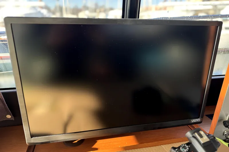 Tequila Little Time II Yacht Photos Pics Vizio monitor inside 2015 Jeanneau NC 14 boat, with reflections on screen.