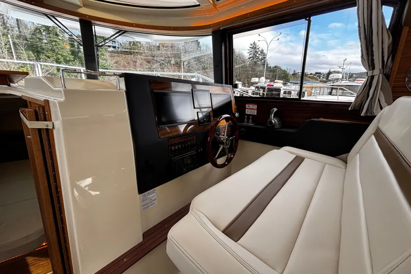  Yacht Photos Pics 2026 Ranger Tugs R-29 CB helm with modern controls and panoramic windows.