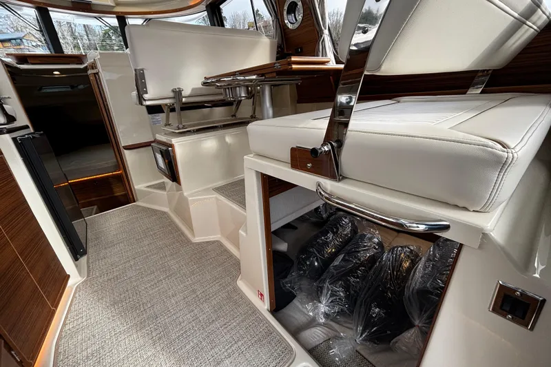  Yacht Photos Pics 2026 Ranger Tugs R-29 CB interior with modern seating and storage.