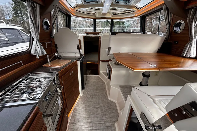  Yacht Photos Pics Interior of 2026 Ranger Tugs R-29 CB, featuring modern kitchen and dining area.