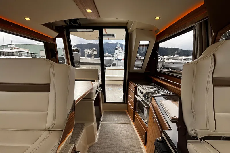  Yacht Photos Pics Luxurious interior of 2026 Ranger Tugs R-29 CB with modern kitchen and seating.