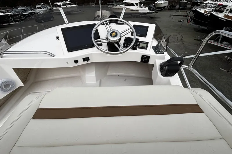  Yacht Photos Pics 2026 Ranger Tugs R-29 CB helm with modern controls and navigation systems.