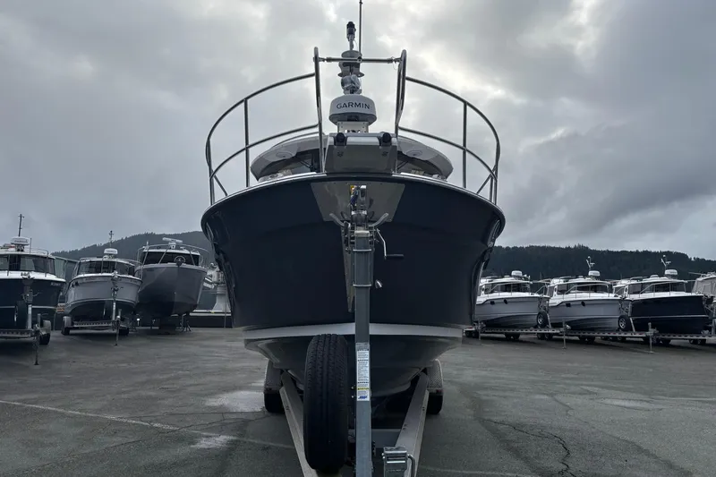  Yacht Photos Pics 2026 Ranger Tugs R-29 CB boat on trailer, cloudy sky background.