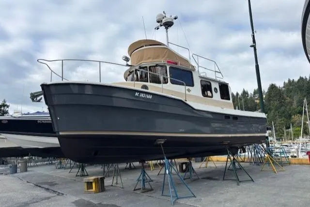 Fish Tank Yacht Photos Pics 2013 Ranger Tugs R-31 boat on stands in a marina setting.