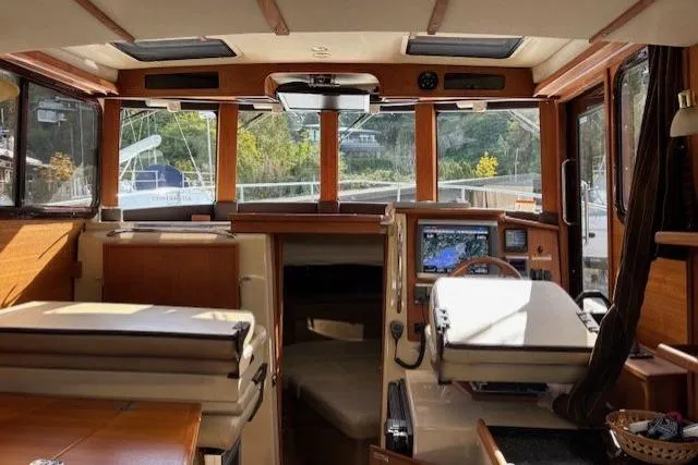 Fish Tank Yacht Photos Pics Interior of 2013 Ranger Tugs R-31 boat with wood accents and navigation equipment.