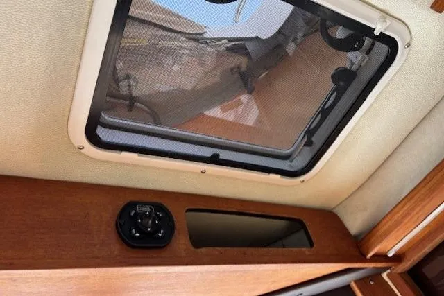 Fish Tank Yacht Photos Pics Interior view of 2013 Ranger Tugs R-31 boat with ceiling hatch and wooden trim.