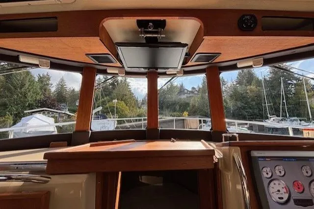Fish Tank Yacht Photos Pics Interior view of 2013 Ranger Tugs R-31 boat with dashboard and windows.