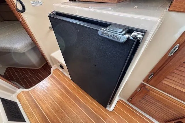 Fish Tank Yacht Photos Pics 2013 Ranger Tugs R-31 interior with Nova Kool fridge and wooden flooring.
