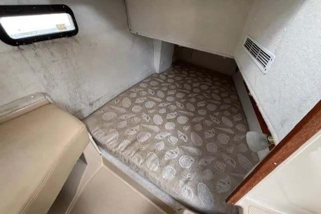 Fish Tank Yacht Photos Pics 2013 Ranger Tugs R-31 cabin interior with patterned mattress and window.