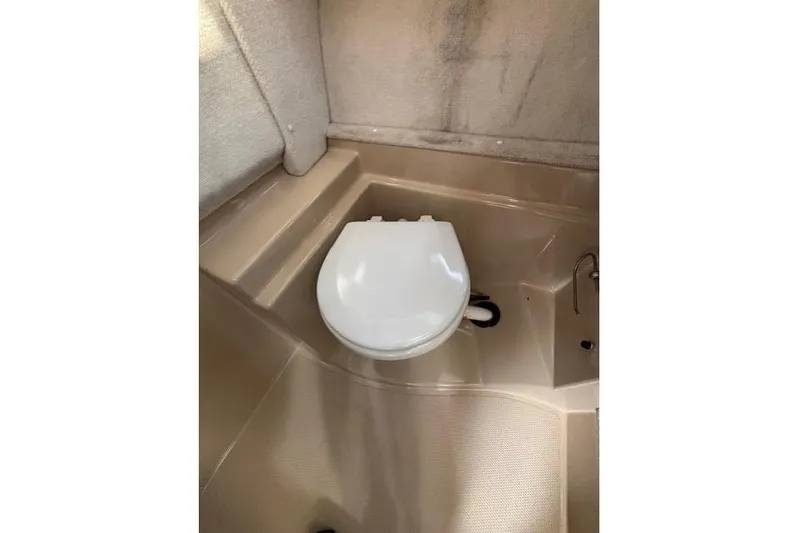 Fish Tank Yacht Photos Pics 2013 Ranger Tugs R-31 boat bathroom with compact toilet and beige interior.