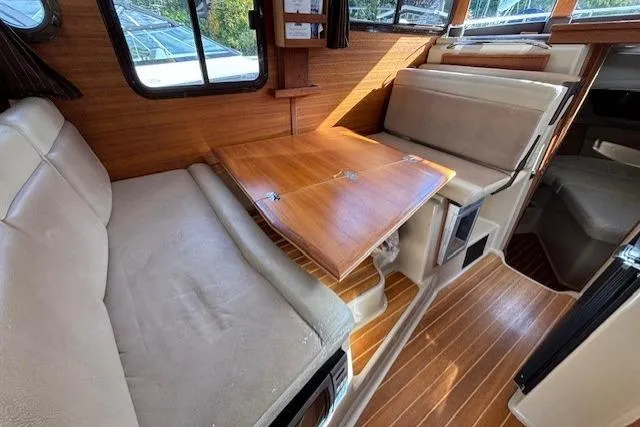Fish Tank Yacht Photos Pics 2013 Ranger Tugs R-31 interior with wood accents and convertible seating area.