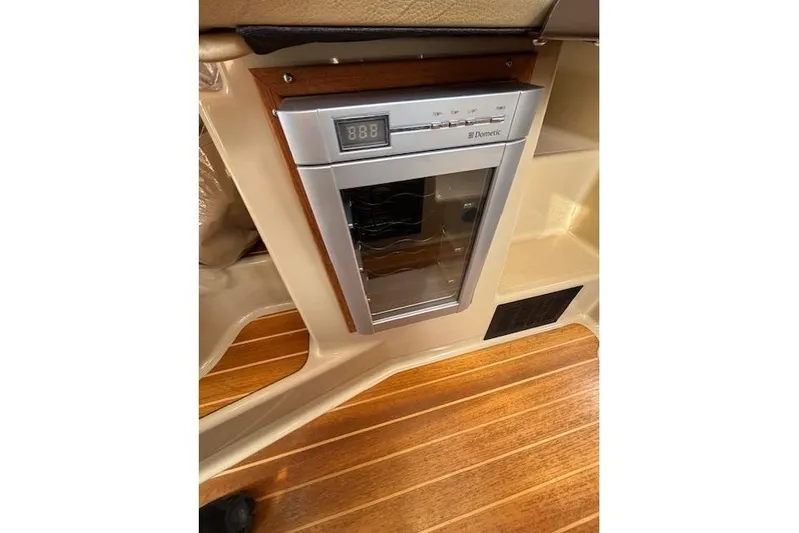 Fish Tank Yacht Photos Pics 2013 Ranger Tugs R-31 interior with Dometic wine cooler and wooden flooring.