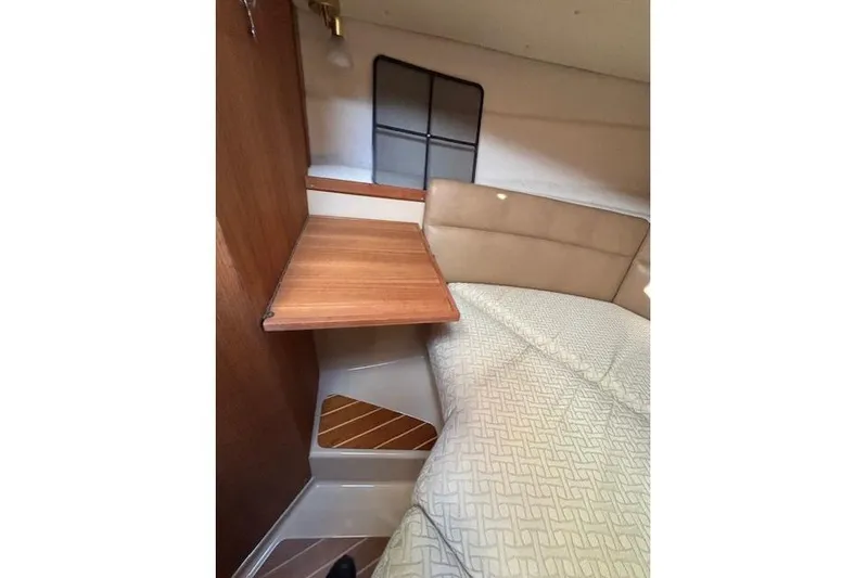 Fish Tank Yacht Photos Pics 2013 Ranger Tugs R-31 interior cabin with wooden table and cushioned seating.