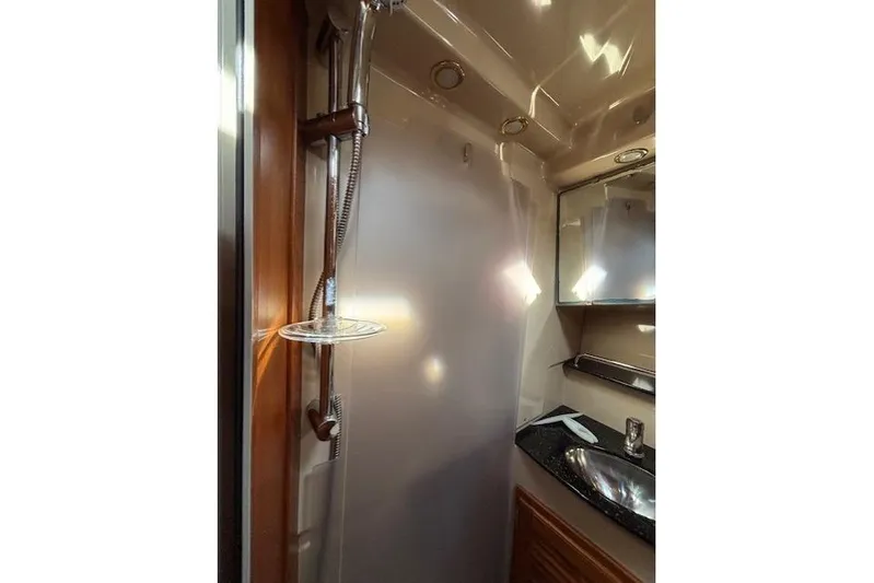 Fish Tank Yacht Photos Pics 2013 Ranger Tugs R-31 bathroom with shower, sink, and mirror.