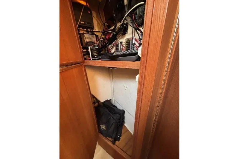 Fish Tank Yacht Photos Pics Electrical compartment inside 2013 Ranger Tugs R-31, showcasing wiring and equipment.