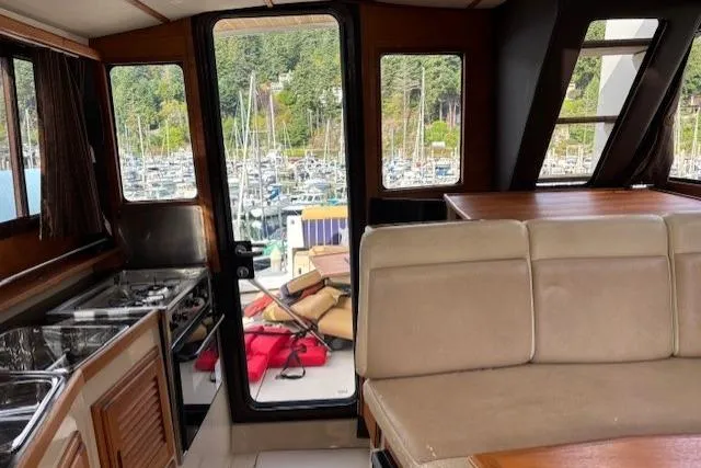 Fish Tank Yacht Photos Pics Interior of 2013 Ranger Tugs R-31 boat with marina view through windows.