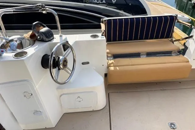 Fish Tank Yacht Photos Pics 2013 Ranger Tugs R-31 boat helm with steering wheel and cushioned seating.