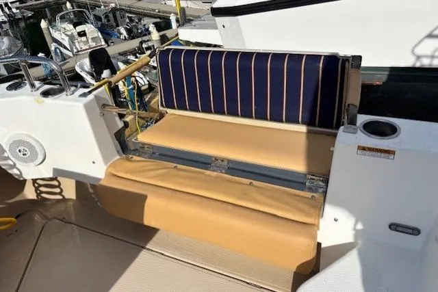 Fish Tank Yacht Photos Pics 2013 Ranger Tugs R-31 boat seating area with striped cushion and cup holder.