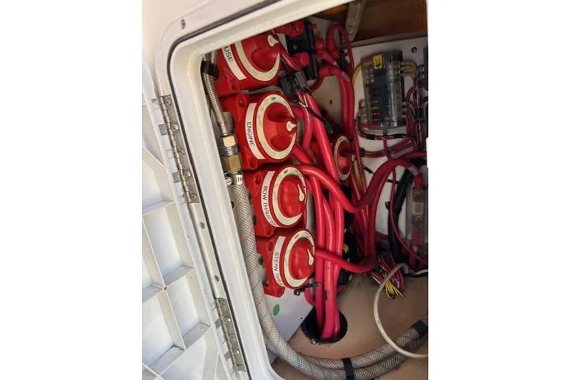 Fish Tank Yacht Photos Pics Electrical panel with red switches and wiring in a 2013 Ranger Tugs R-31 boat.