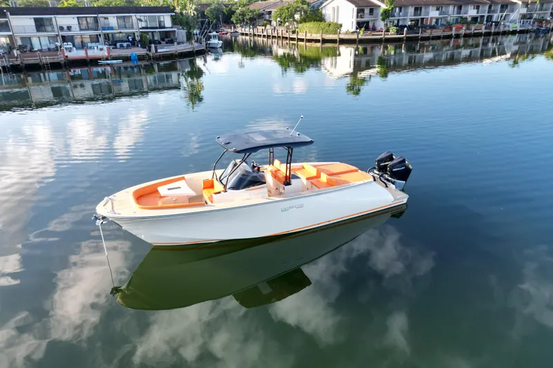  Yacht Photos Pics 2026 Lilybaeum Lipari 31 boat on calm water near waterfront homes.