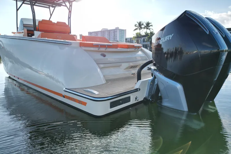  Yacht Photos Pics 2026 Lilybaeum Lipari 31 boat with dual Mercury engines, docked in calm waters.