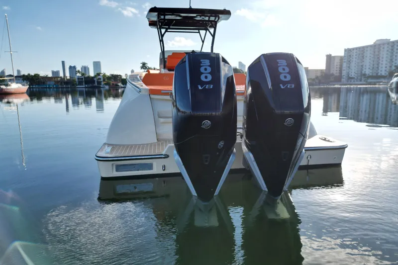  Yacht Photos Pics 2026 Lilybaeum Lipari 31 boat with dual 300 V8 engines docked in a serene marina.
