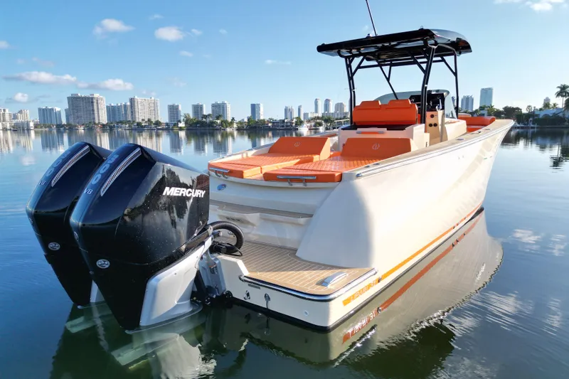  Yacht Photos Pics 2026 Lilybaeum Lipari 31 boat with dual Mercury engines on calm water.
