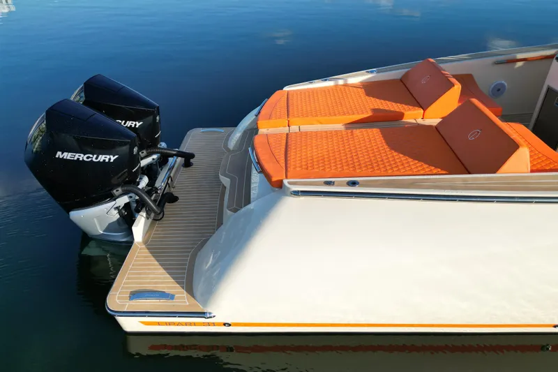 Yacht Photos Pics 2026 Lilybaeum Lipari 31 boat with orange seating and dual Mercury engines.