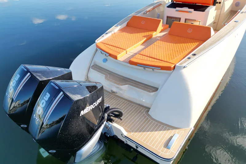  Yacht Photos Pics 2026 Lilybaeum Lipari 31 boat with dual Mercury 300 V8 engines, orange seating.