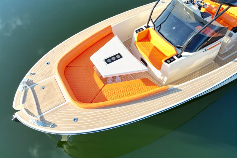 Yacht Photos Pics 2026 Lilybaeum Lipari 31 boat with orange seating and sleek design on calm water.