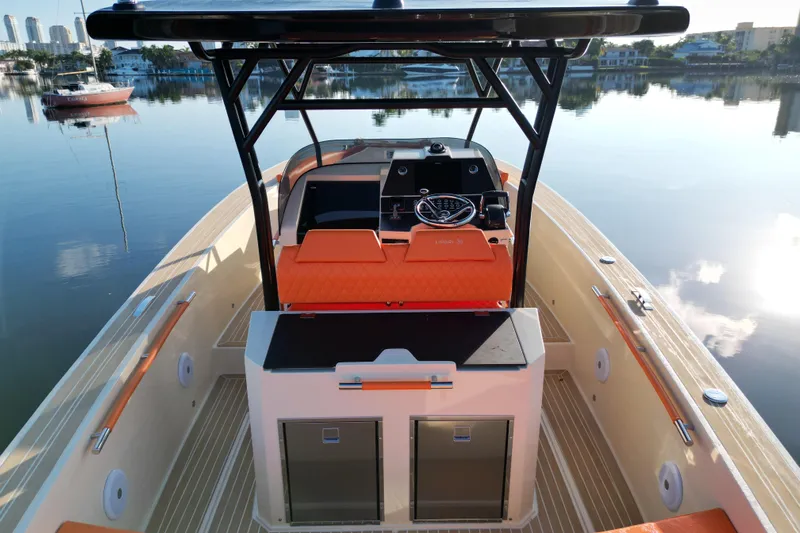  Yacht Photos Pics 2026 Lilybaeum Lipari 31 boat interior with orange seating, sleek design, and modern controls.