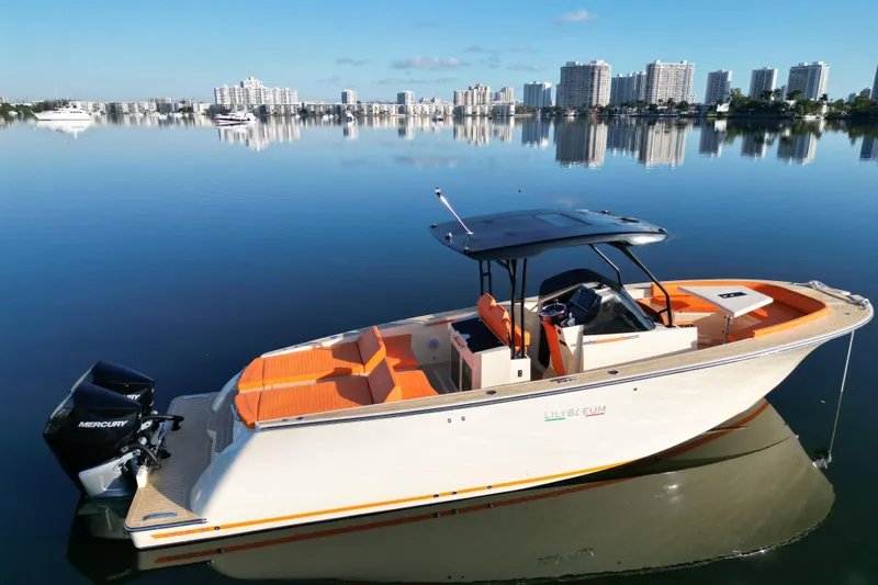  Yacht Photos Pics 2026 Lilybaeum Lipari 31 boat on calm water with city skyline in background.