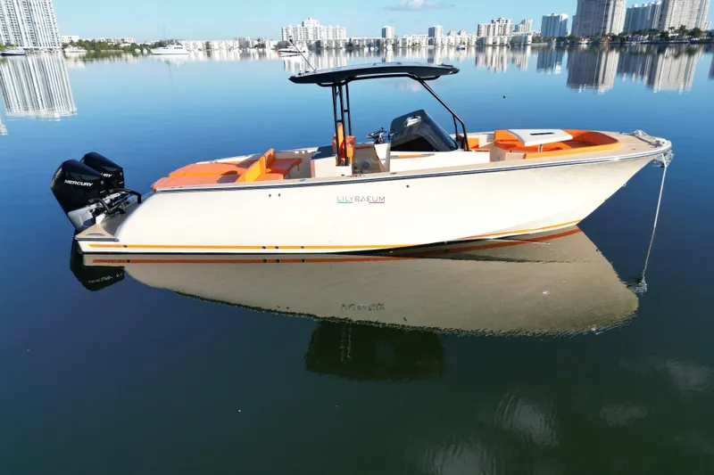  Yacht Photos Pics 2026 Lilybaeum Lipari 31 boat on calm water with city skyline background.
